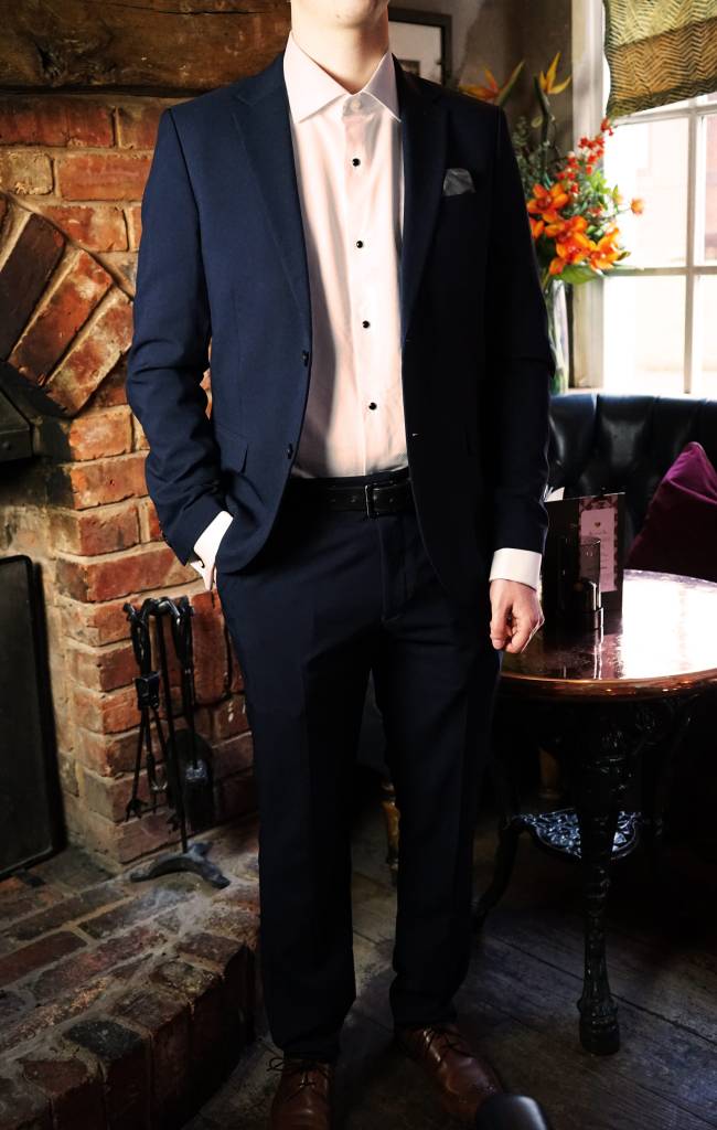 Man wearing a suit in bar